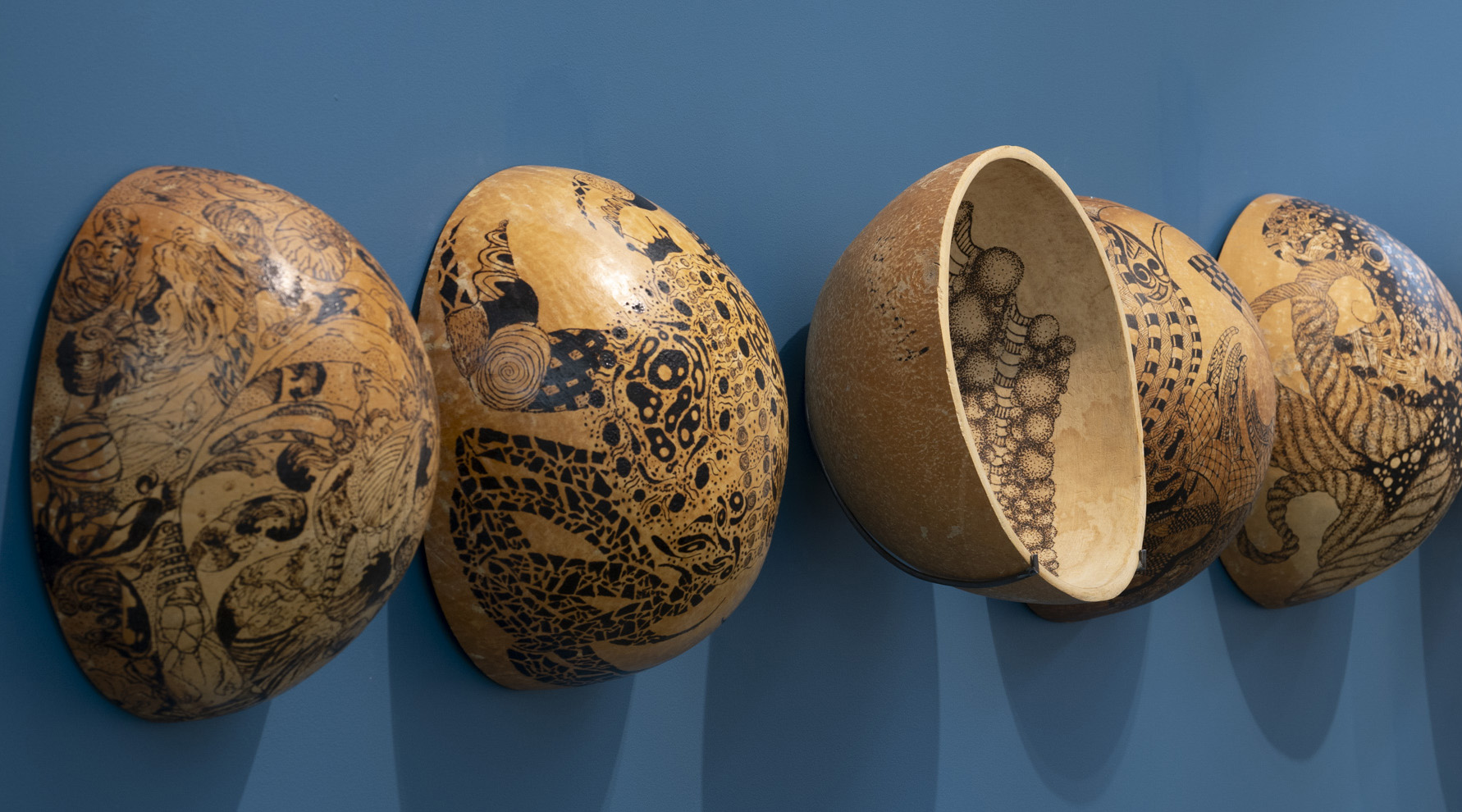 Gourds carved and burned into patterns