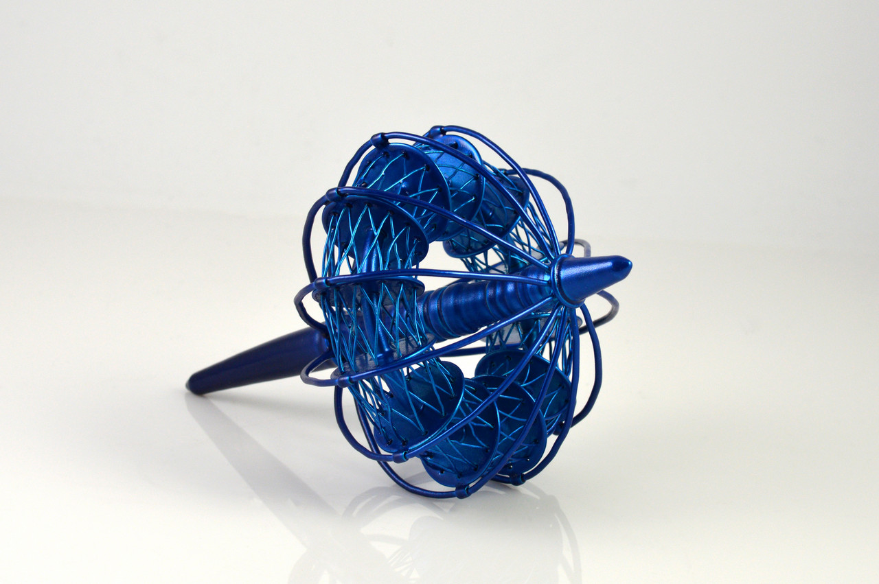 An image of artwork made of blue, intertwined copper and brass 